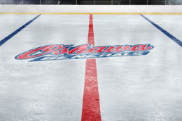 Oshawa logo on hockey ice rink