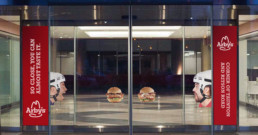 hockey players with open mouths receiving sandwiches when doors open