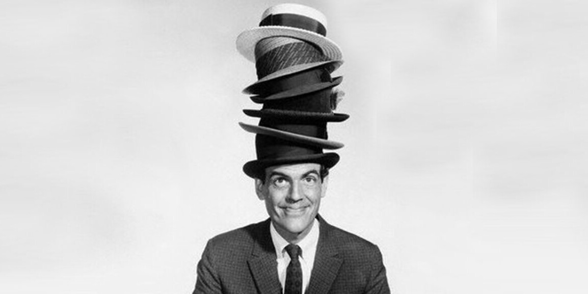 man wearing stack of hats