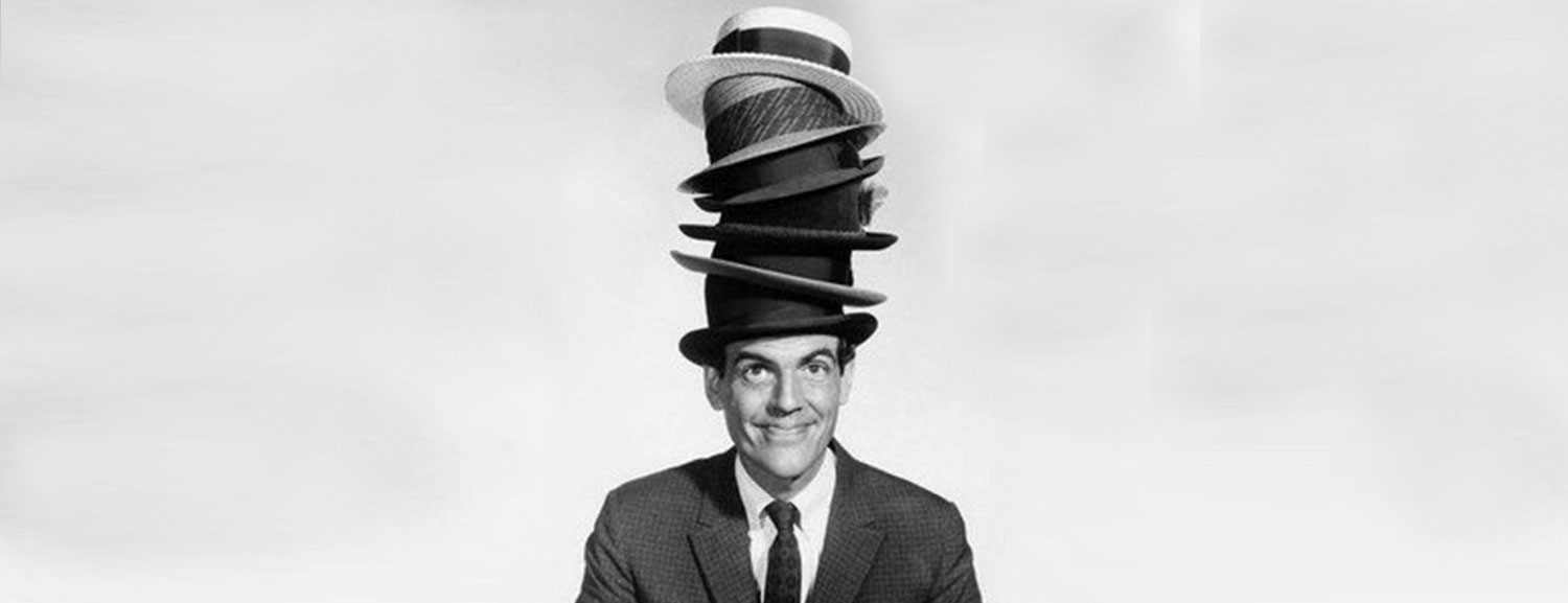 man wearing stack of hats