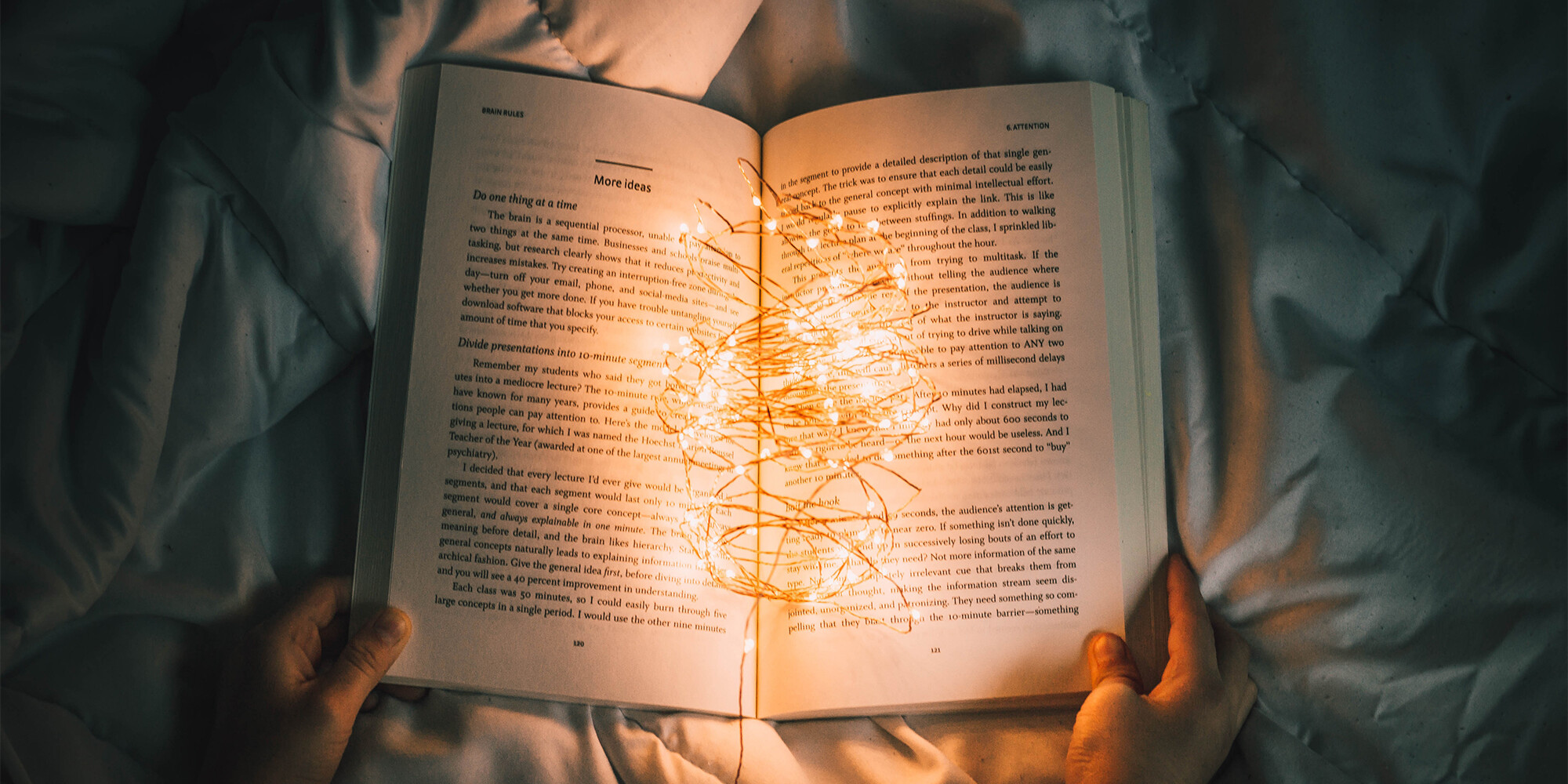 book with fairy lights in the middle
