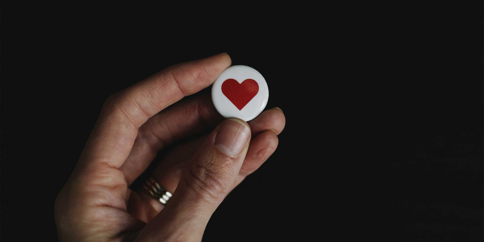 hand holding heart icon