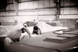 Black and white photo of Intrepid Powerboat being built