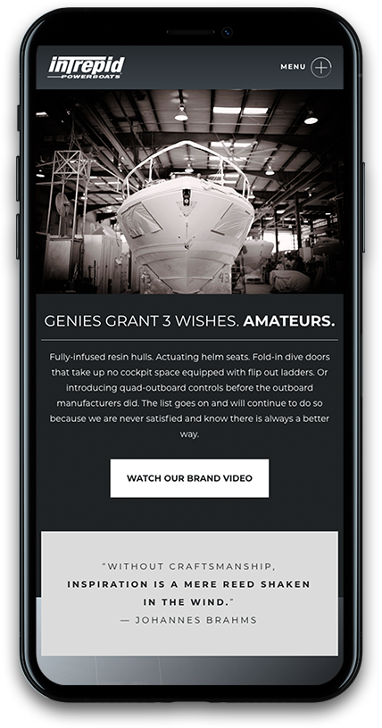 Intrepid mobile website mockup featuring black and white photo of boat being built