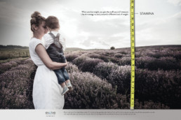 evolve mother holding child in lavender field