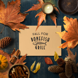 Fall for bonefish flat lay with autumn leaves and pinecones